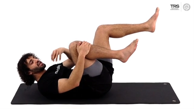 Lying Foot Over Knee Stretch